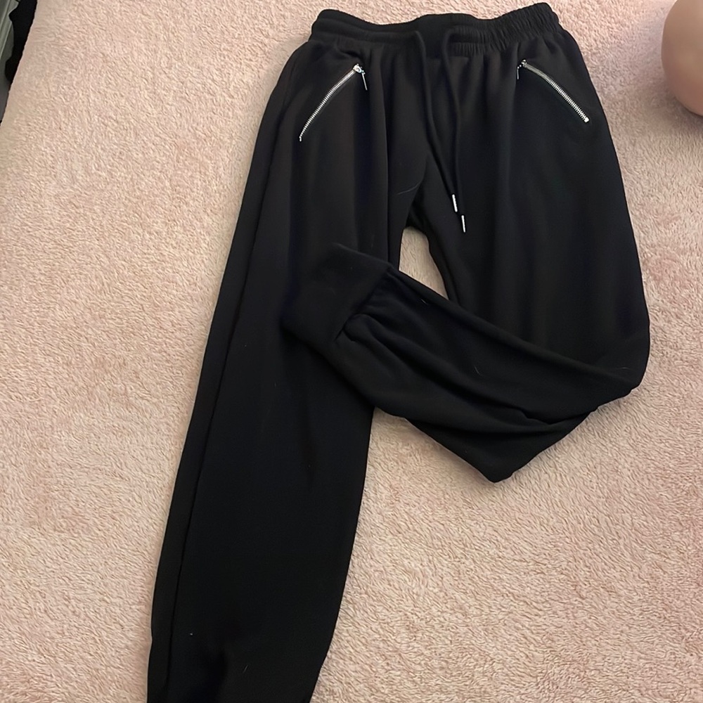 Black joggers with gold zipper